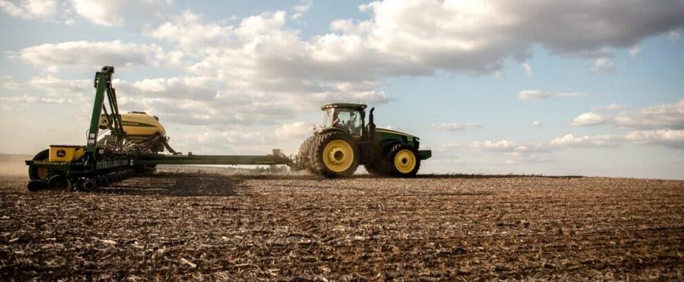 Farmer planting soybeans