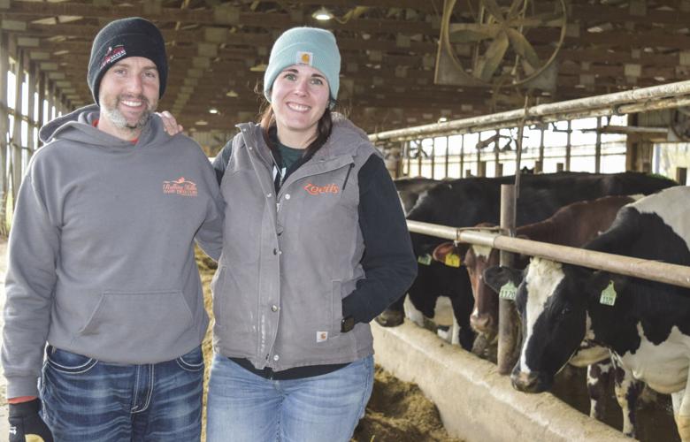 Nate and Morgan Kliebenstein in freestall barn