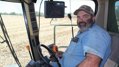 Mike Schreiman harvests a field of corn