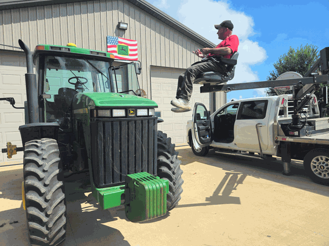 farmer lift into field tractor