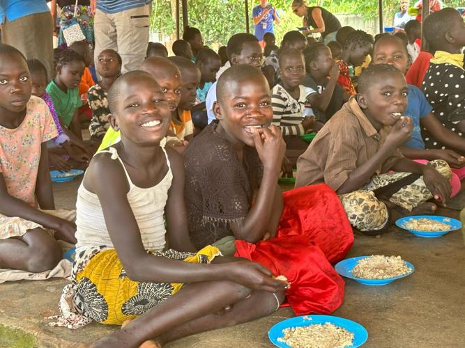 Youngsters enjoy nutritious rice packet.jpg