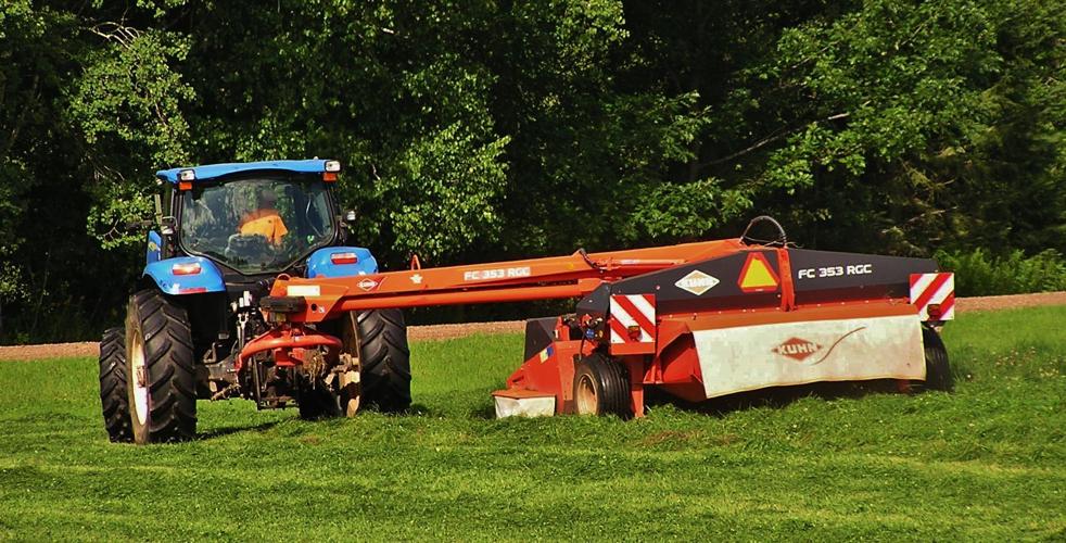 Farmer haying in field