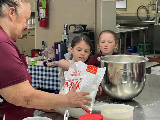students help make bread