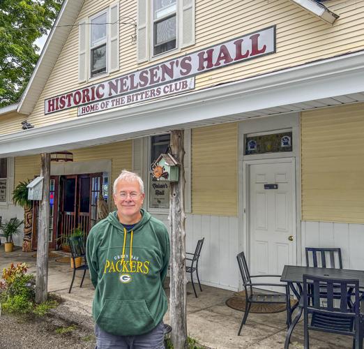 Chris Hardie poses in front of Nelsen’s Hall.