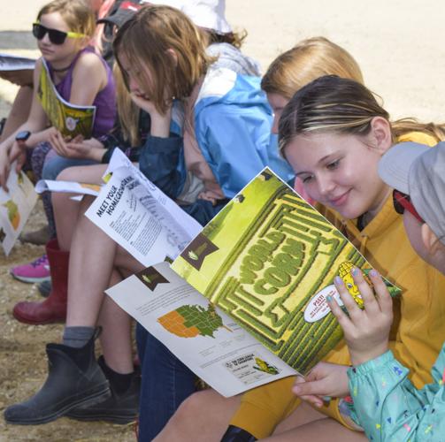 Girl Scouts reading World of Corn