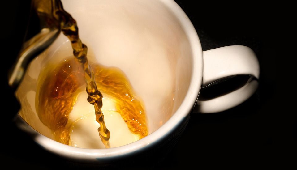 Pouring coffee into cup