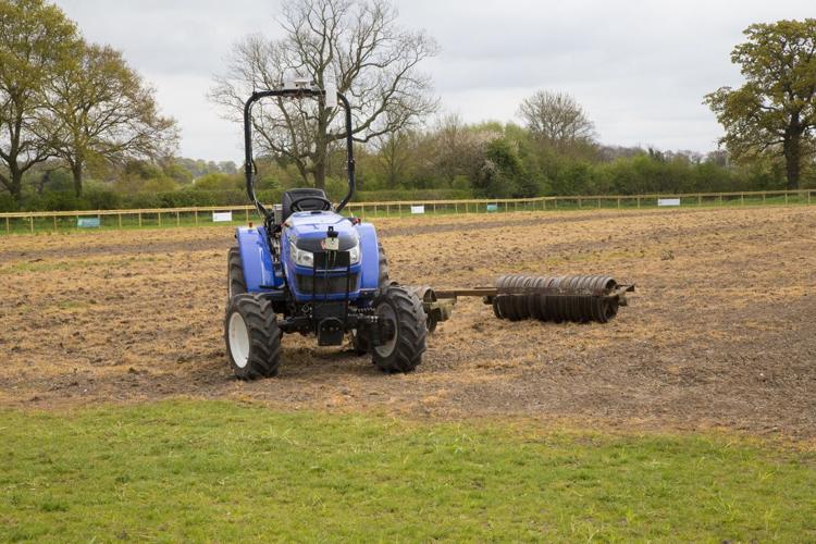 British researchers convert a small Iseki tractor into an autonomous robot to work in a spring-barley field.