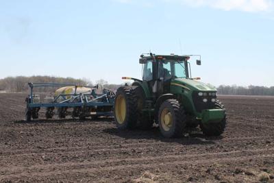 tractor and planter in field