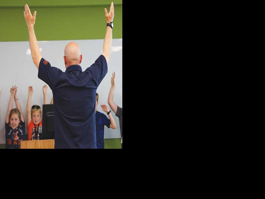 Anthony Studer teaches children about corn