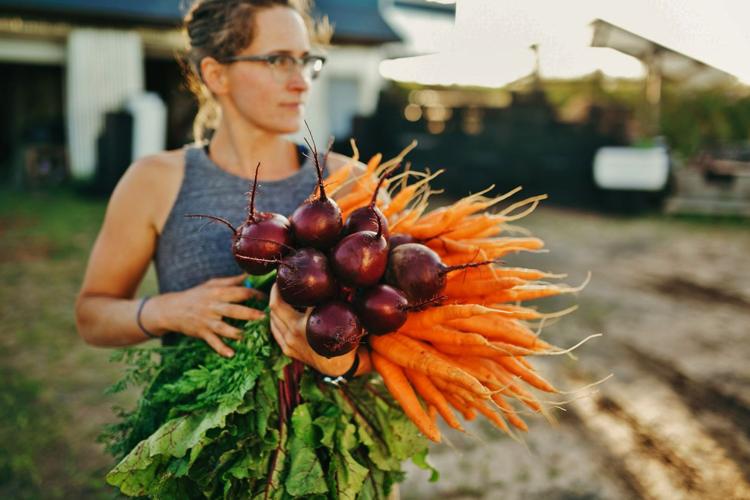 Stacey Botsford with beets and carrots