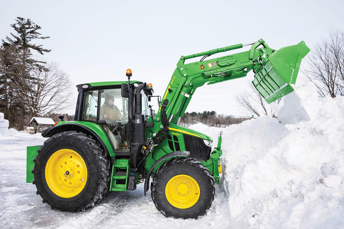 John Deere tractor in snow