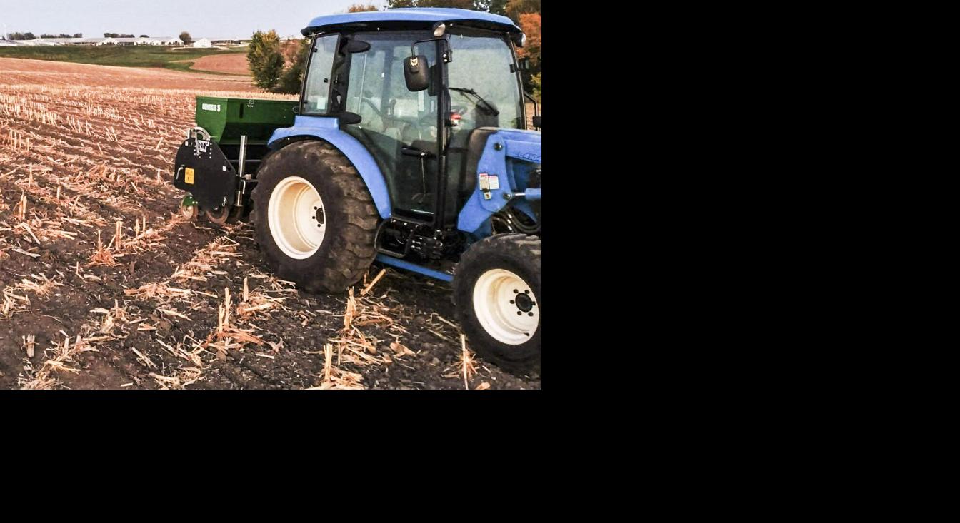 No-till drill and tractor in field