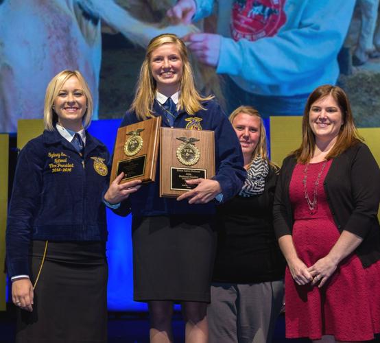 Erica Helmer at National FFA Convention with advisors