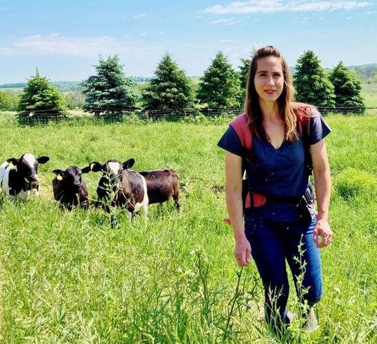 Carrie Stevens in pasture with cattle