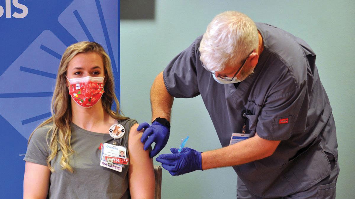 Alli Edmunds receives her COVID-19 vaccination