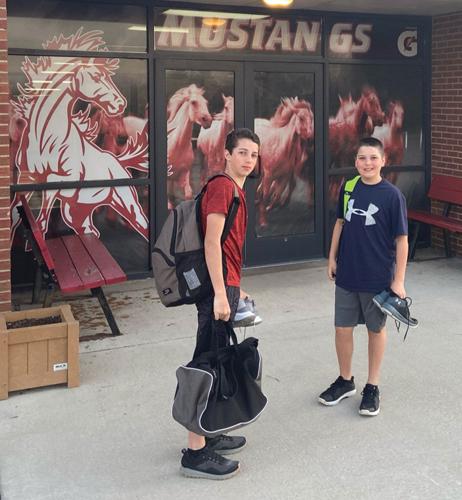 Levi and Nathan Wright head into school.