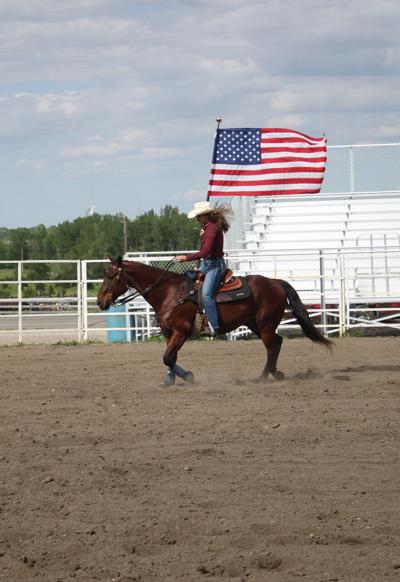 Emma Jacobson and her horse, Diesel, show their American spirit