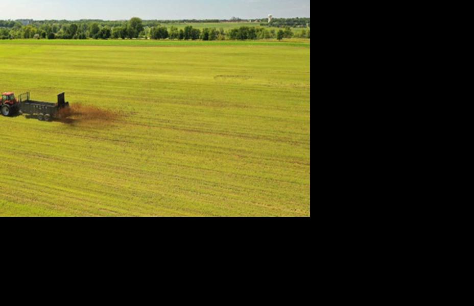 Tractor spreading manure
