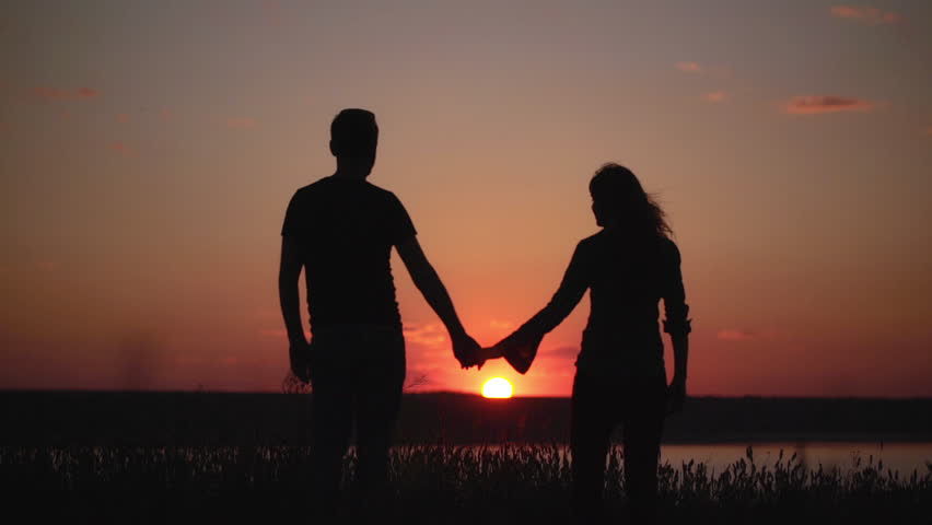 Silhouette of couple and sunset