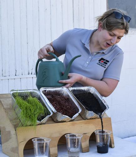 Rachel Gerbitz simulating impact of rainfall on soil