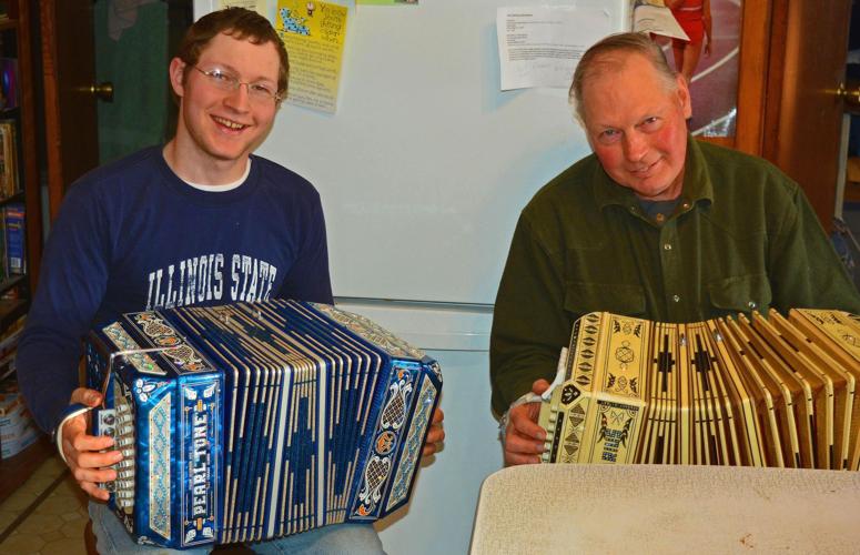 Matt Wundrow, left, and his dad, Leslie Wundrow, play their concertinas