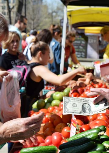Cash transaction at Dane County Farmers Market
