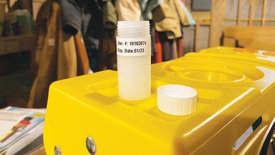 Short-term radon test kit set up in the basement.