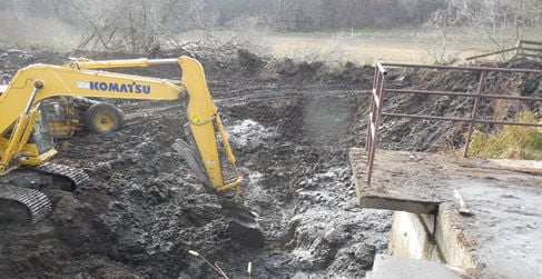 Working on old manure pit