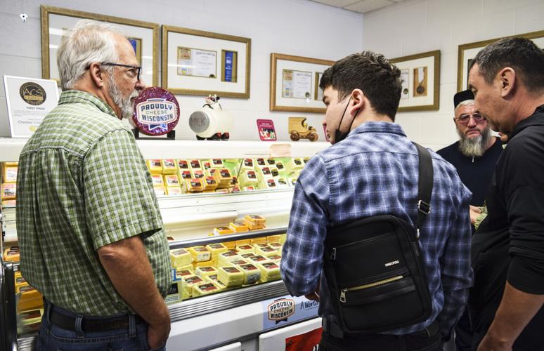 Bob Wills talks about cheese varieties at cheese case