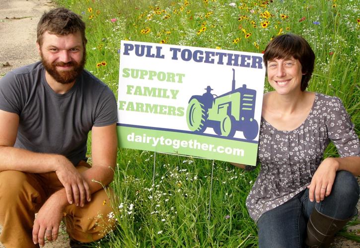 Caleb and Lauren Langworthy display sign
