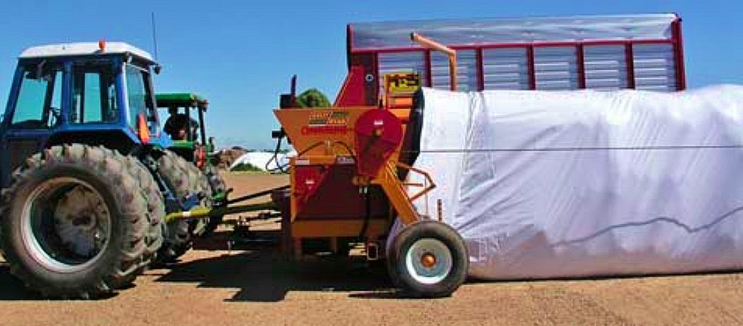 Tractor with feed storage in bag