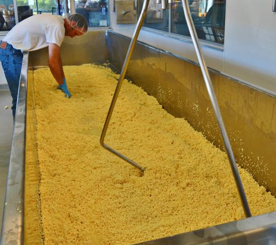 Ron Henningfeld works through cheese
