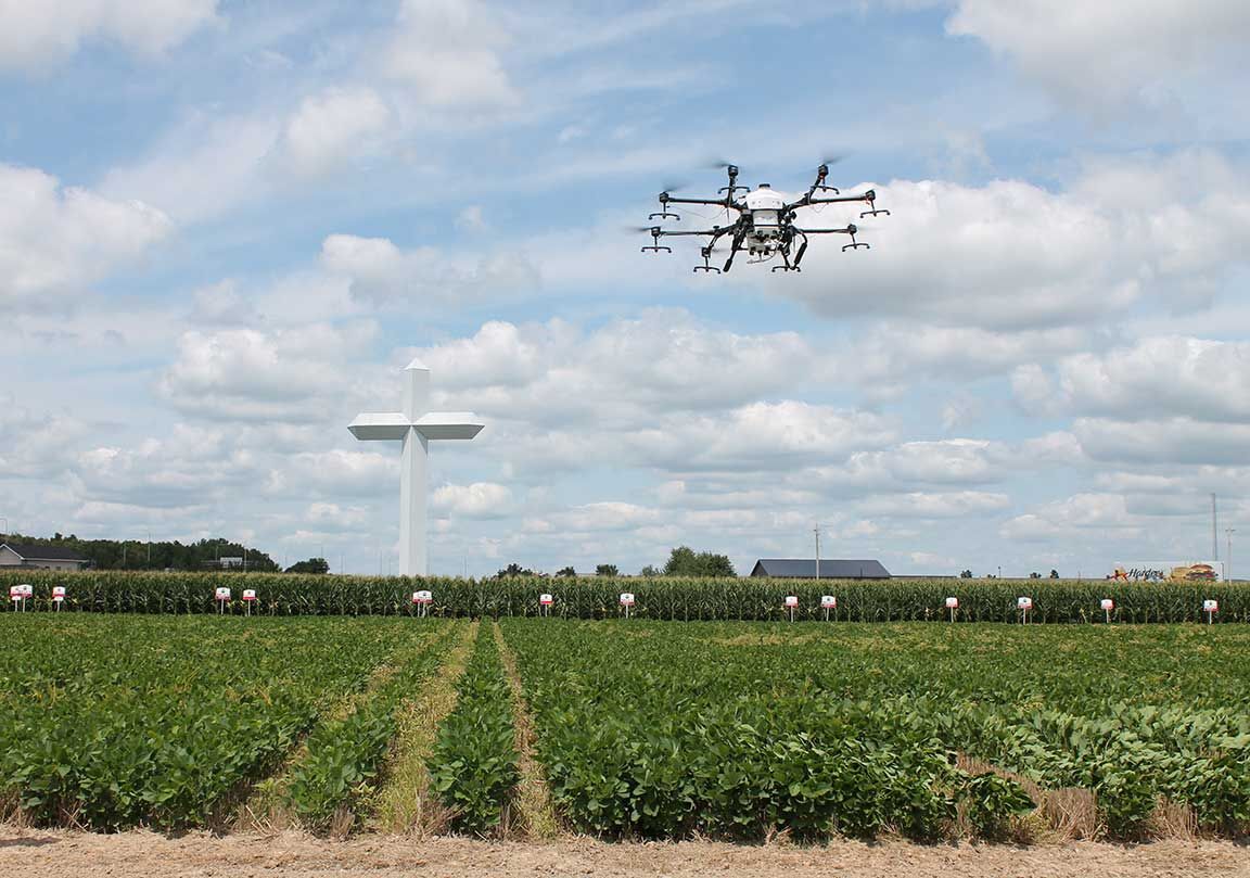 drone flies over a field