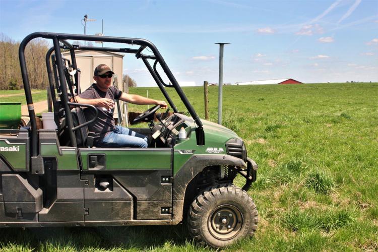 Jason Cavadini inspects water-monitoring station