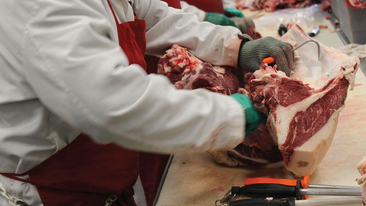 Meat processing butcher closeup