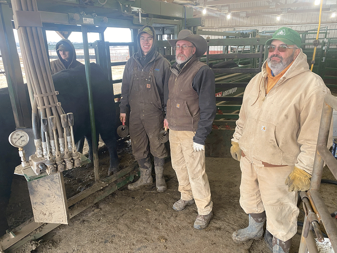 farm employees Keith Nelson, Bryan Neubauer and Grant Boyd