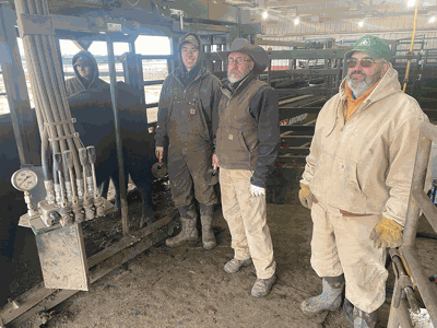 farm employees Keith Nelson, Bryan Neubauer and Grant Boyd