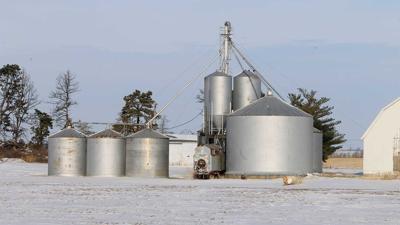 Winter grain bins snow on ground