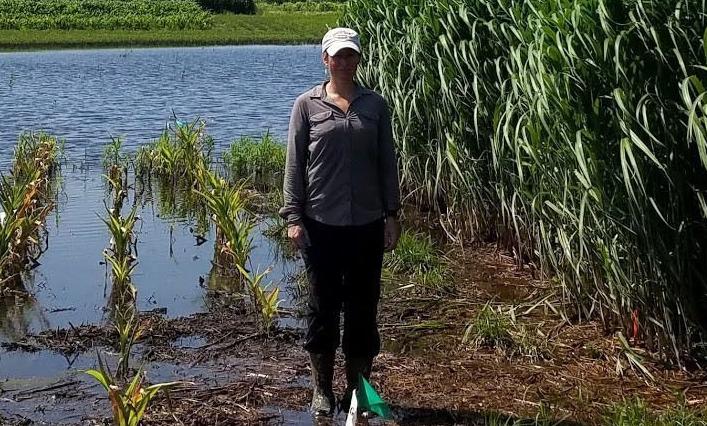 Emily Heaton stands in 'pothole'