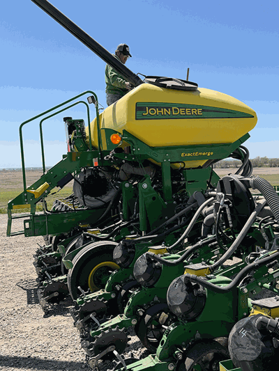 Pat Moore fills up the planter