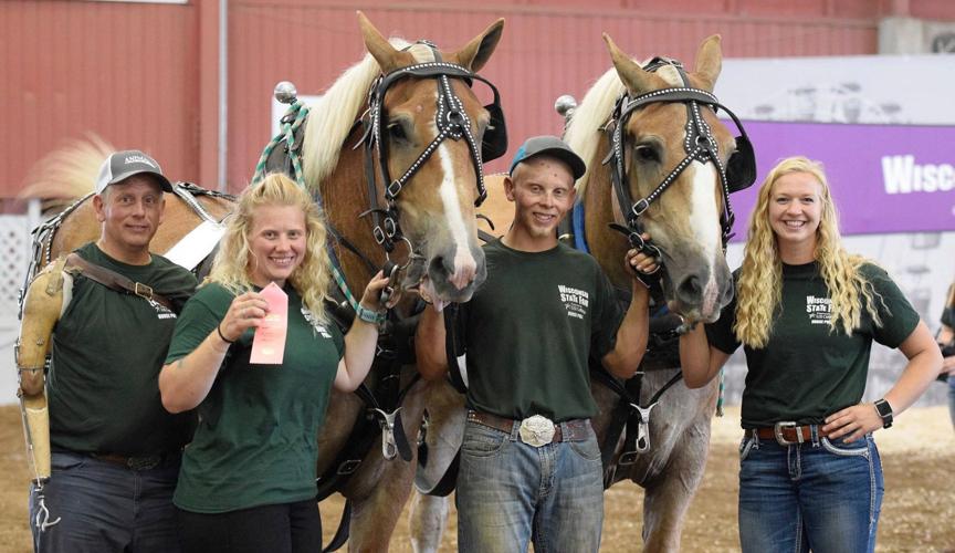 Ingles and Anderson family competing in horse pull at Wisconsin State Fair