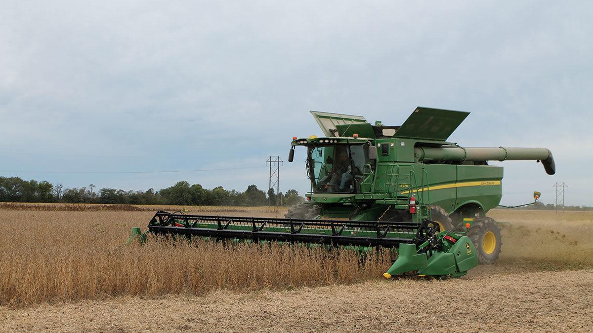 Greg Rush harvests a field of soybeans