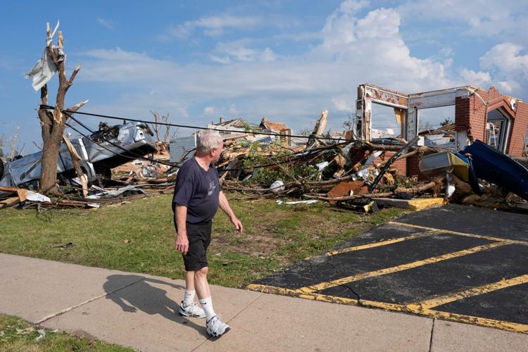 A man views a destroyed Manderfield’s Home Bakery following severe weather, including a tornado Monday, July 27, 2026, in