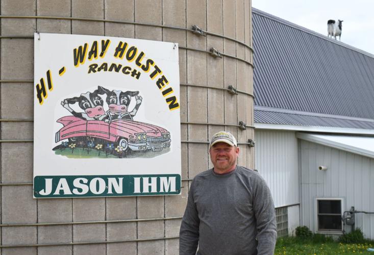 Jason Ihm with Hi-Way Holstein Ranch sign