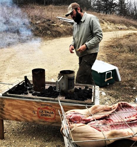 Jeremy Lynch preparing to roast pork