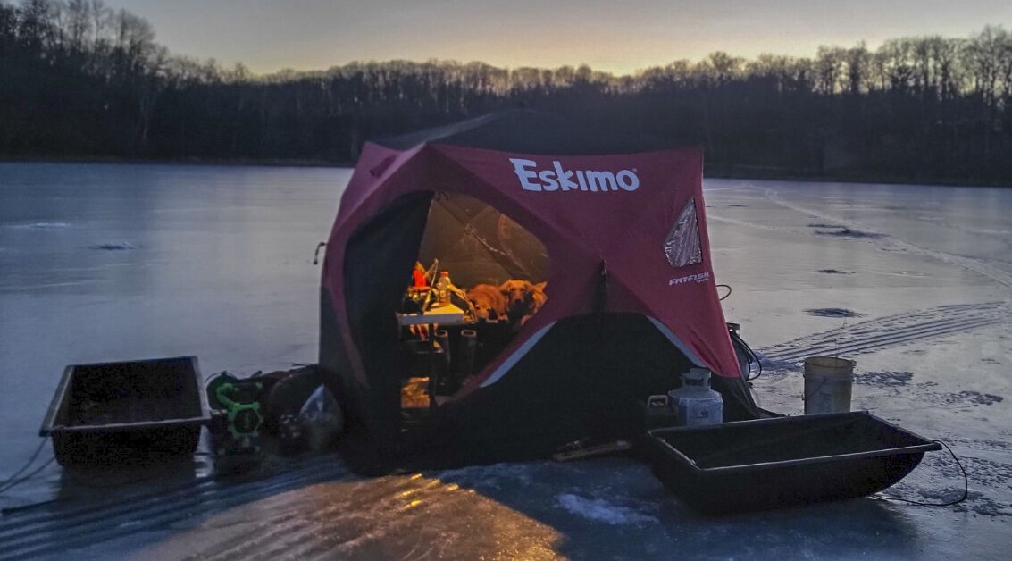 Ice shack on lake