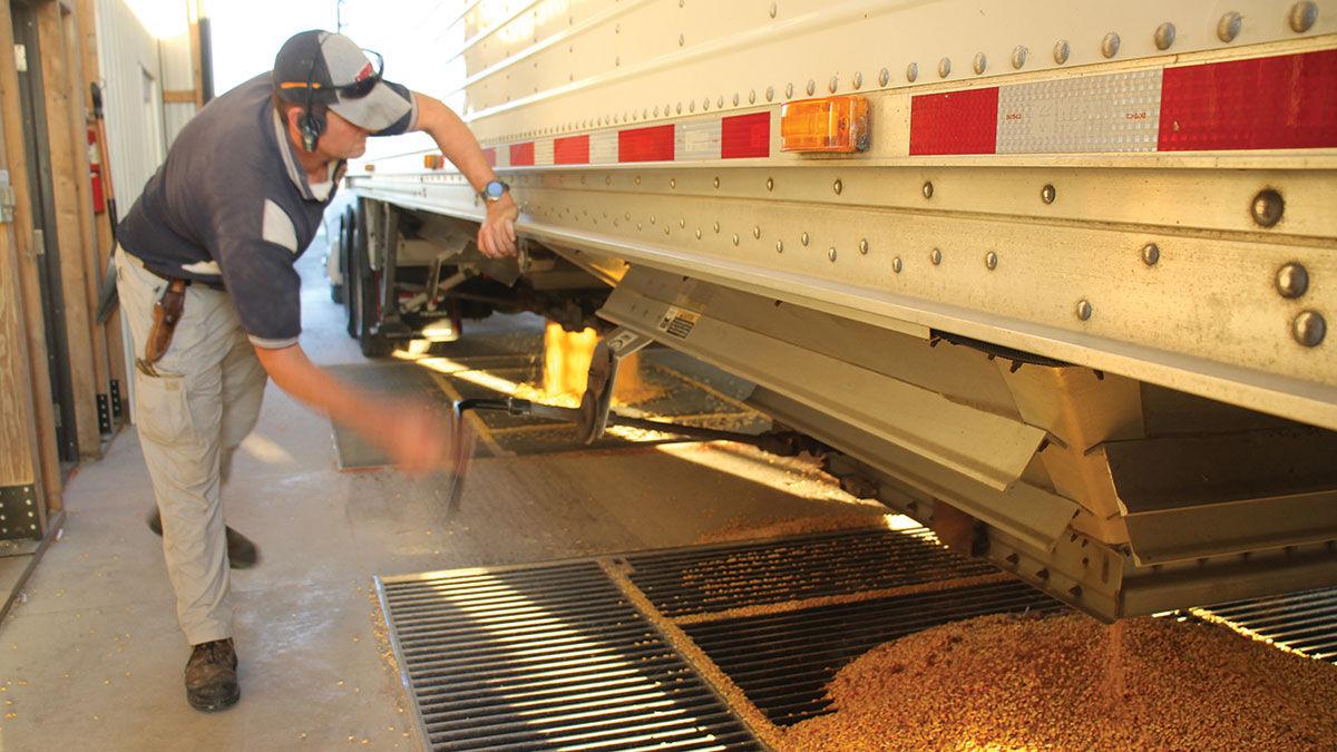 Grant Strom unloads a semi-truck