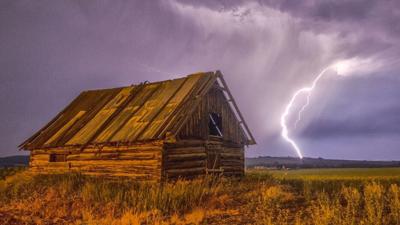 Lightning strikes in field near barn