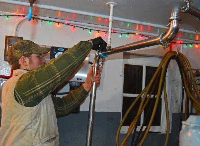 Matt Wundrow clamps a stainless steel pipeline