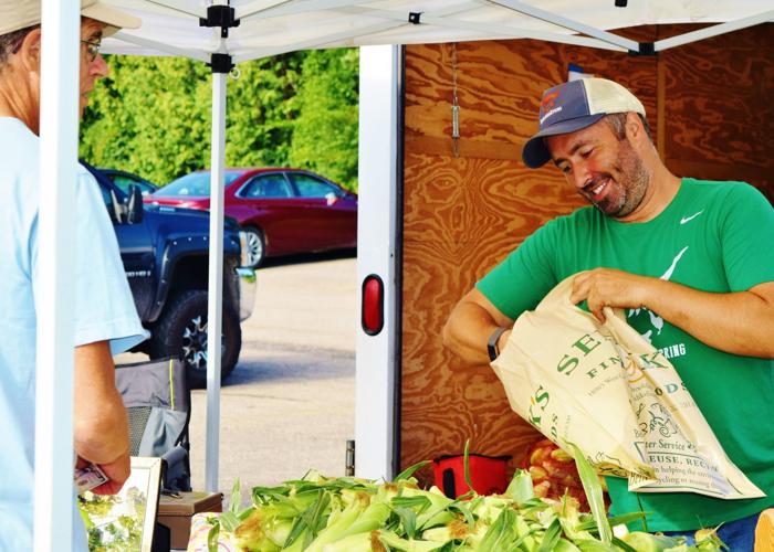 Kevin Oppermann sells sweet corn